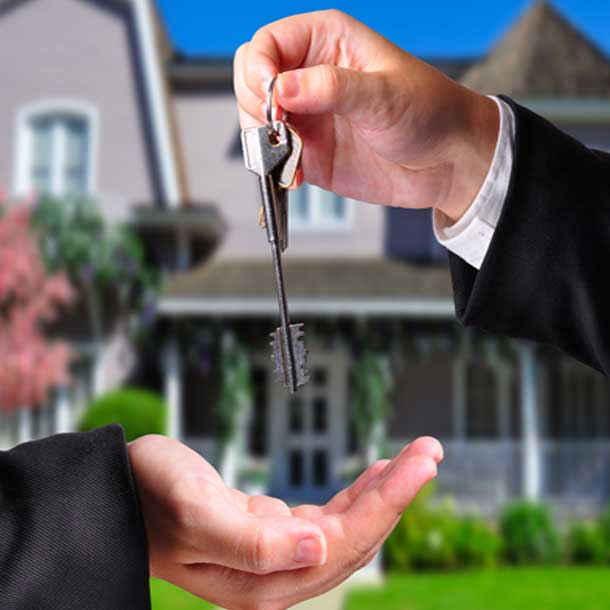mortgage broker giving key to house in Victoria BC